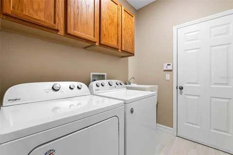 a living room with a large window and a table