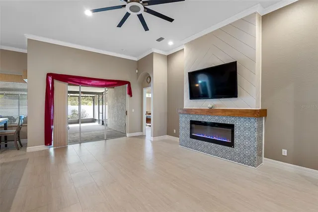 a living room with a fireplace and a flat screen tv