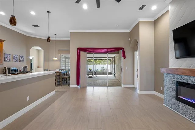 a view of a kitchen with a sink and a fireplace