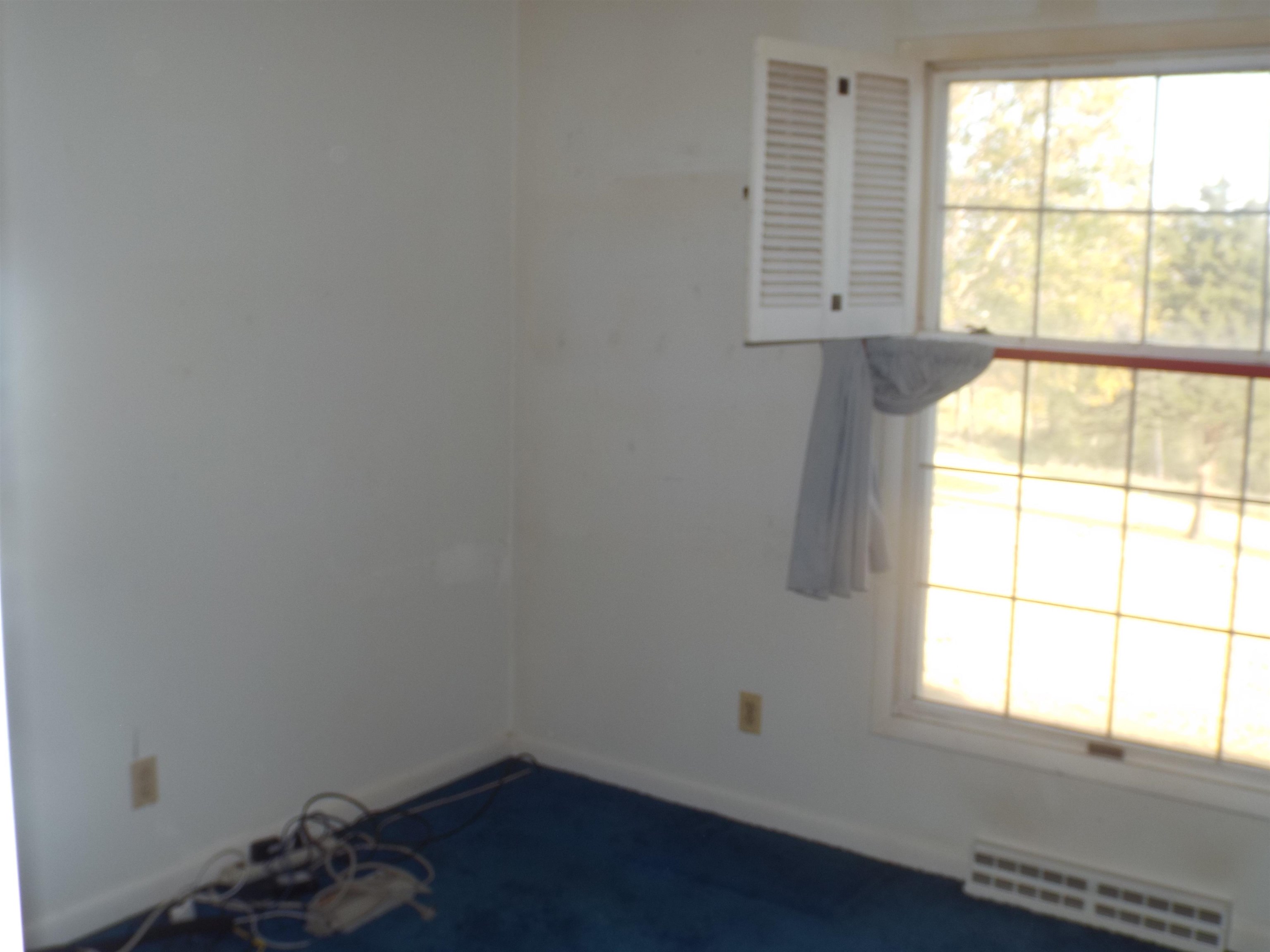 6090 South Rodden Road Hanover, IL 61041 - Photo 11 of 34 an empty room with a window
