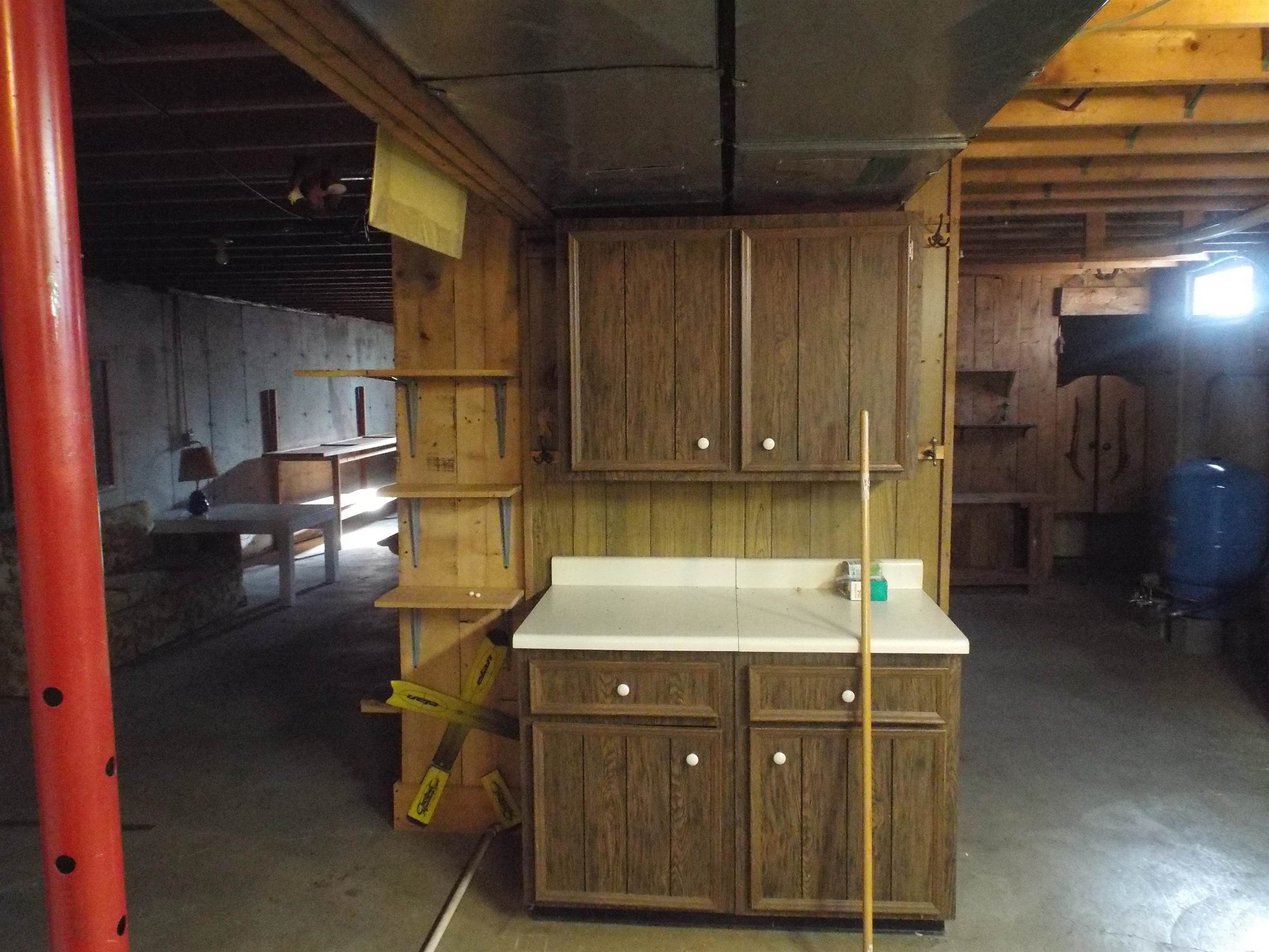 6090 South Rodden Road Hanover, IL 61041 - Photo 15 of 34 a kitchen with kitchen island a counter space and a sink