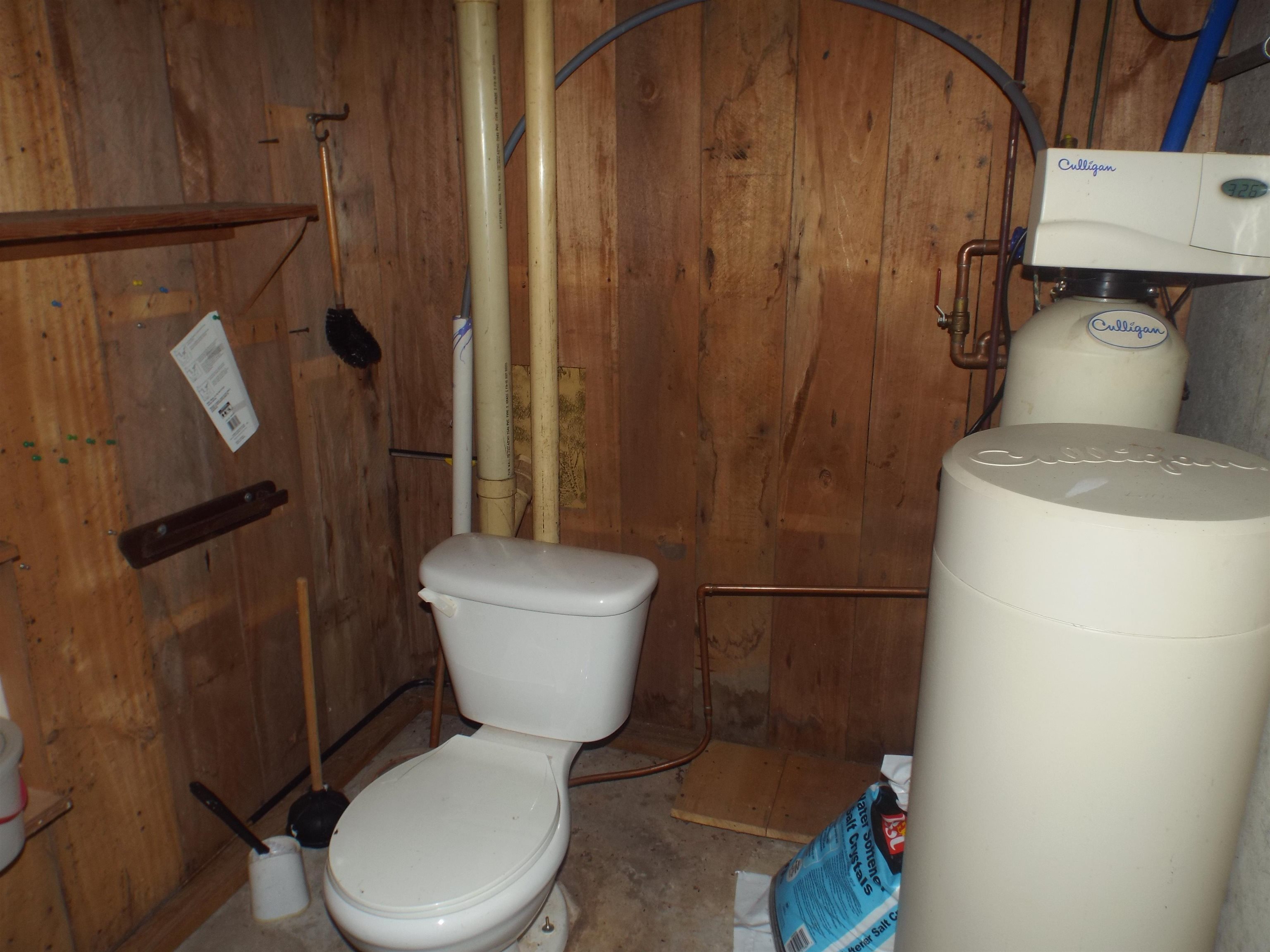 6090 South Rodden Road Hanover, IL 61041 - Photo 16 of 34 a white toilet sitting next to a bathroom sink