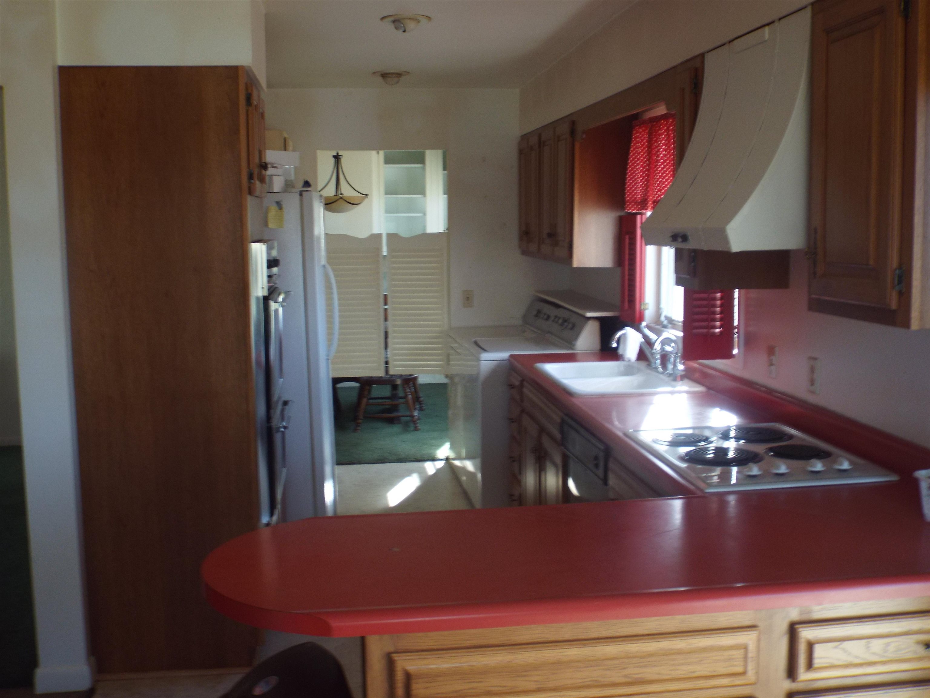 6090 South Rodden Road Hanover, IL 61041 - Photo 2 of 34 a kitchen with stainless steel appliances granite countertop a stove a refrigerator and a dining table