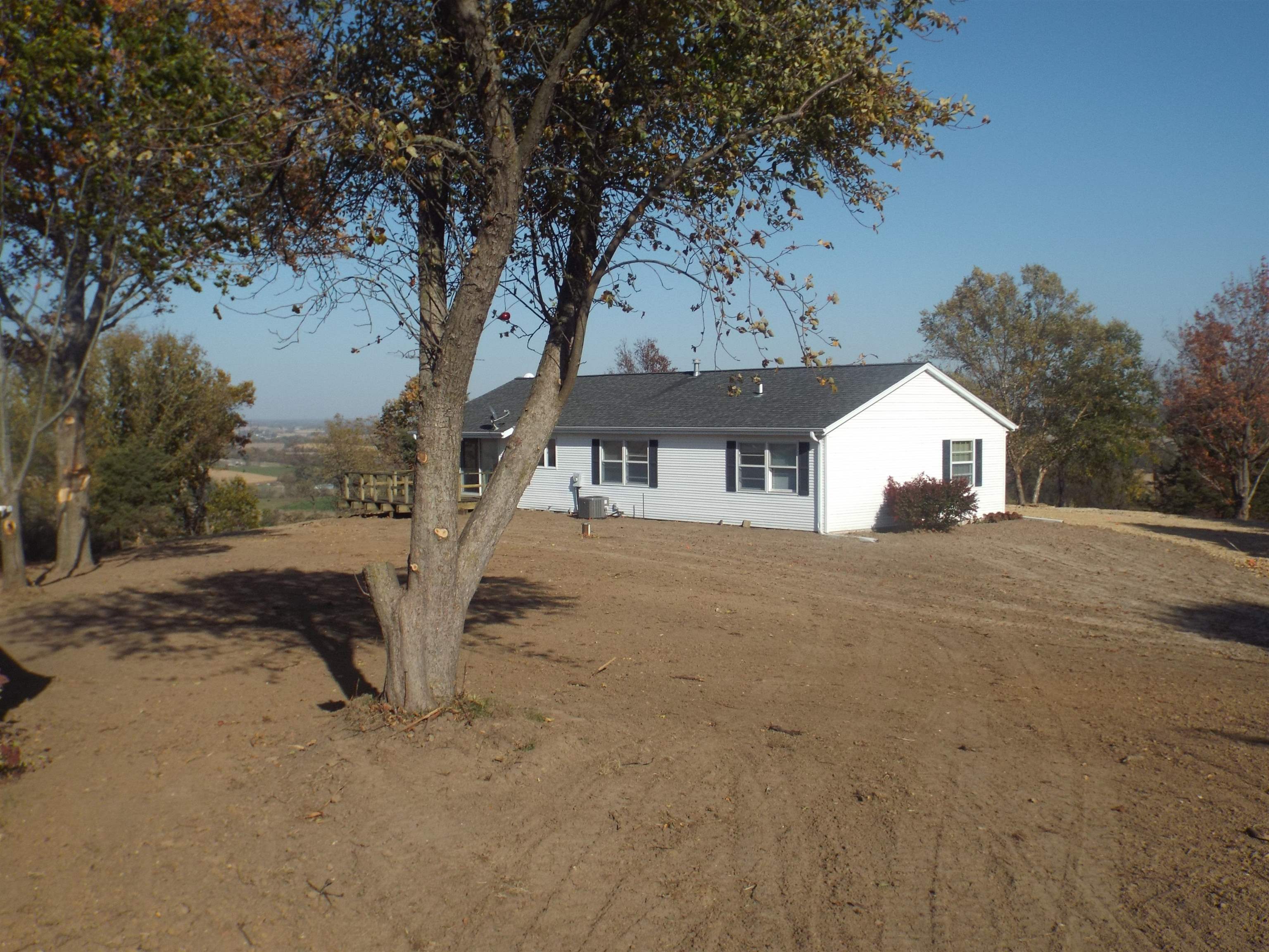 6090 South Rodden Road Hanover, IL 61041 - Photo 22 of 34 a view of a house with a tree in the background