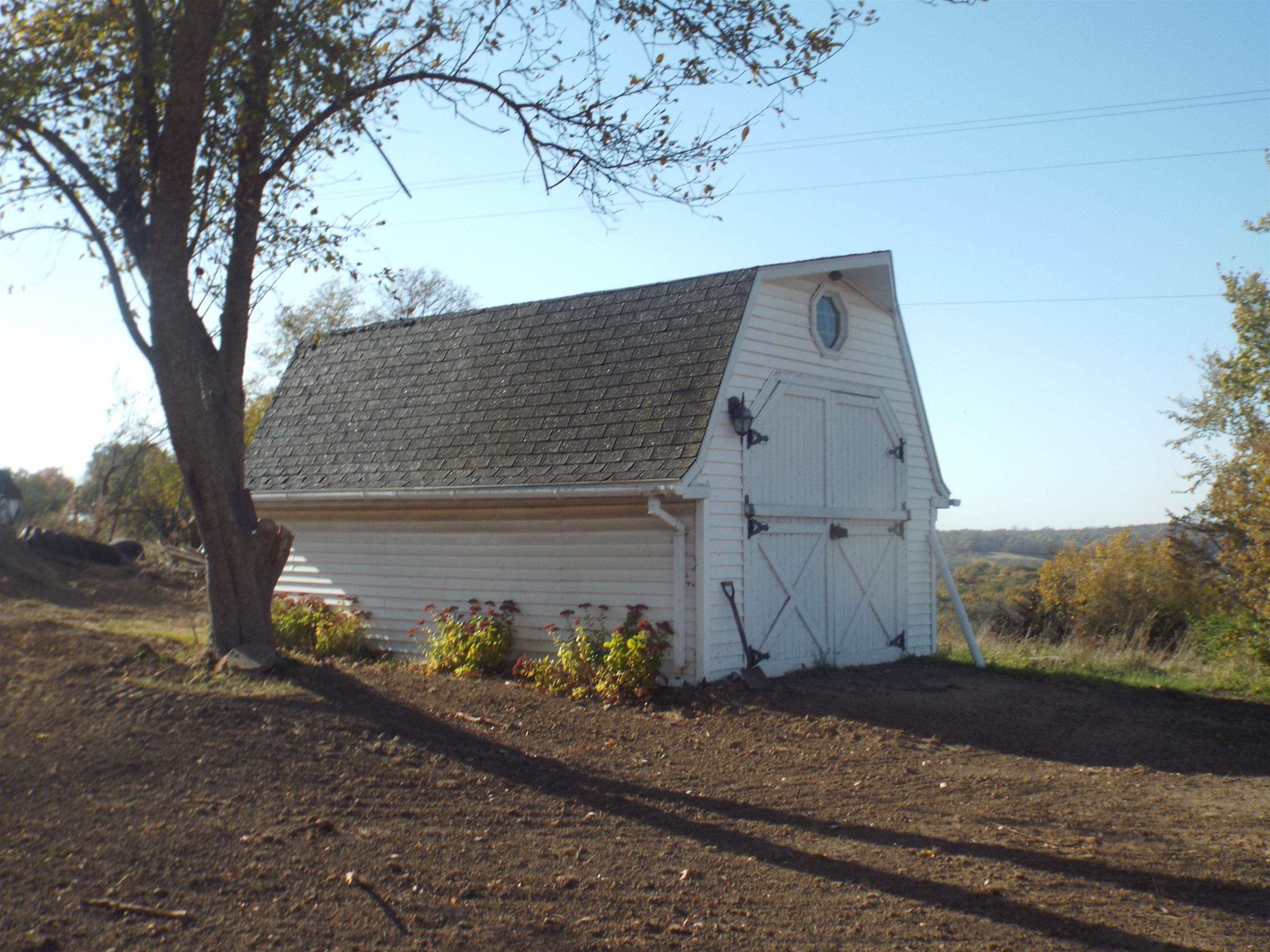 6090 South Rodden Road Hanover, IL 61041 - Photo 25 of 34 a front view of a house with a yard