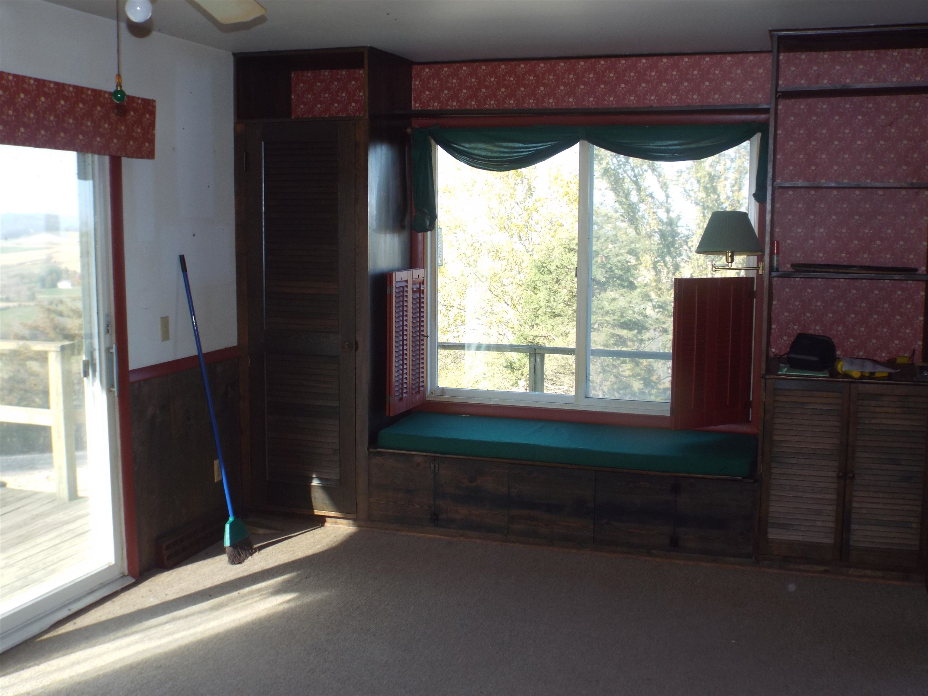 6090 South Rodden Road Hanover, IL 61041 - Photo 4 of 34 a view of room with window and front door