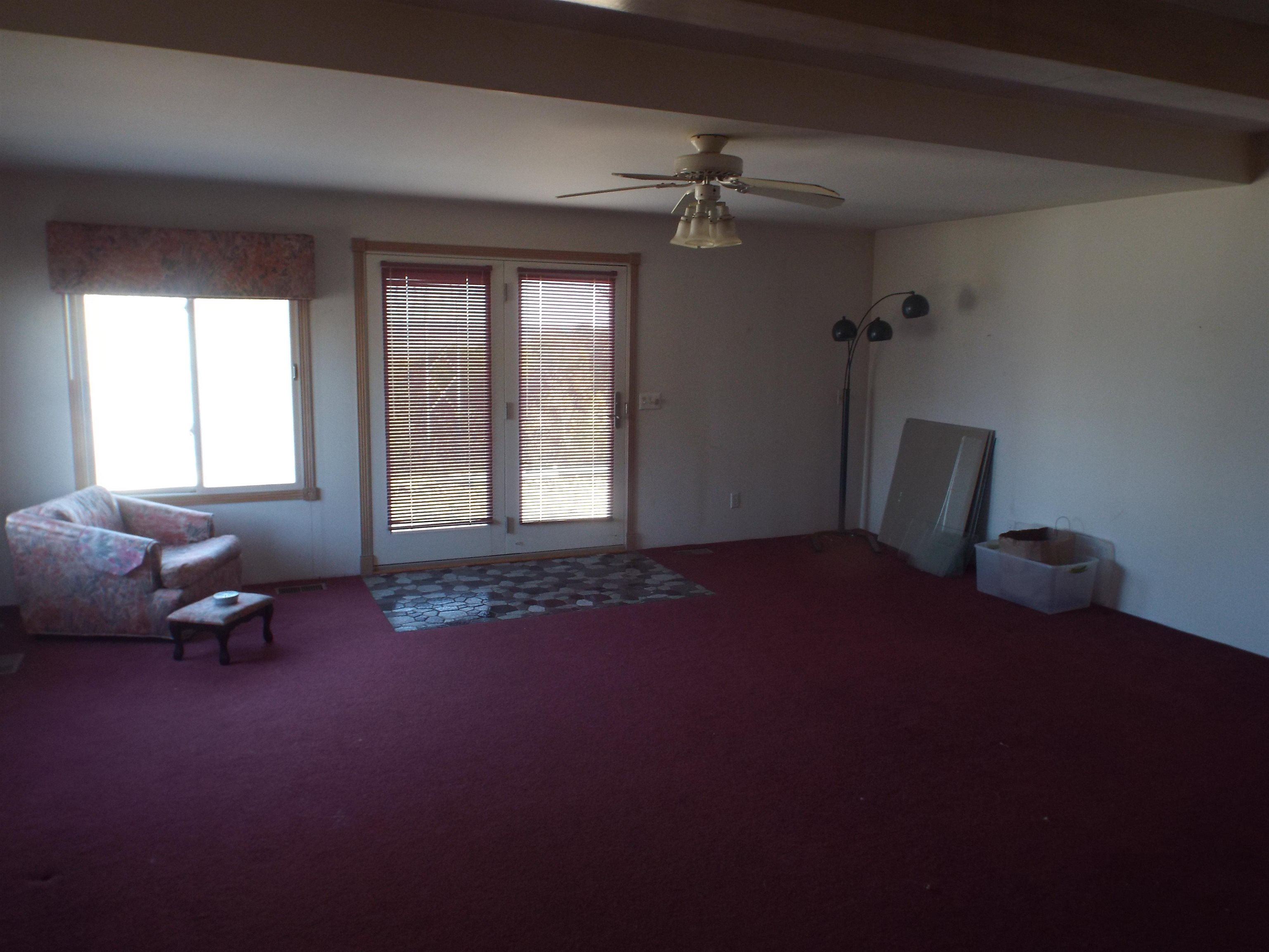 6090 South Rodden Road Hanover, IL 61041 - Photo 6 of 34 a living room with furniture and a window