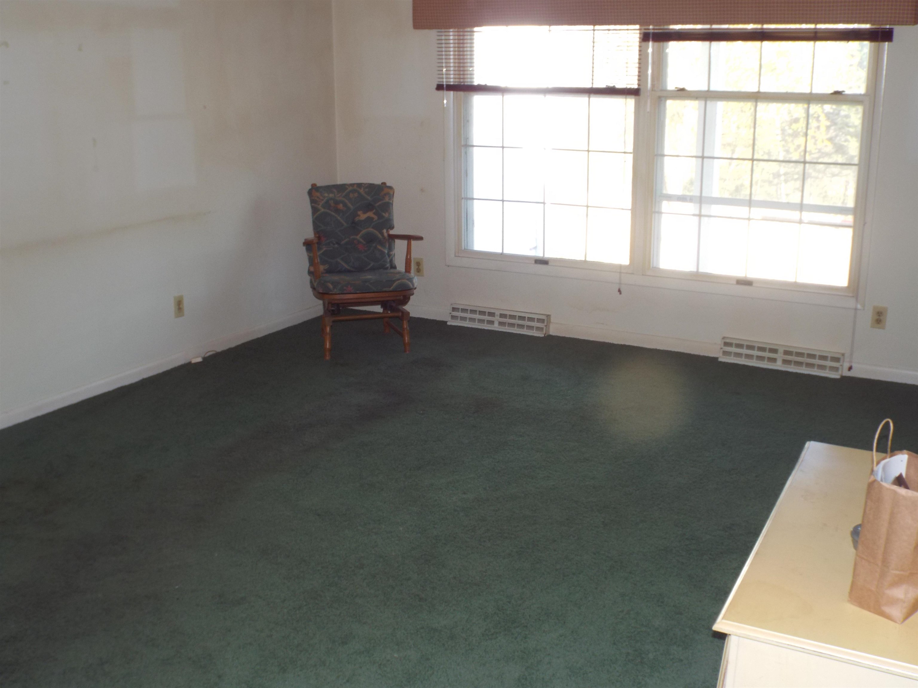 6090 South Rodden Road Hanover, IL 61041 - Photo 8 of 34 an empty room with a window
