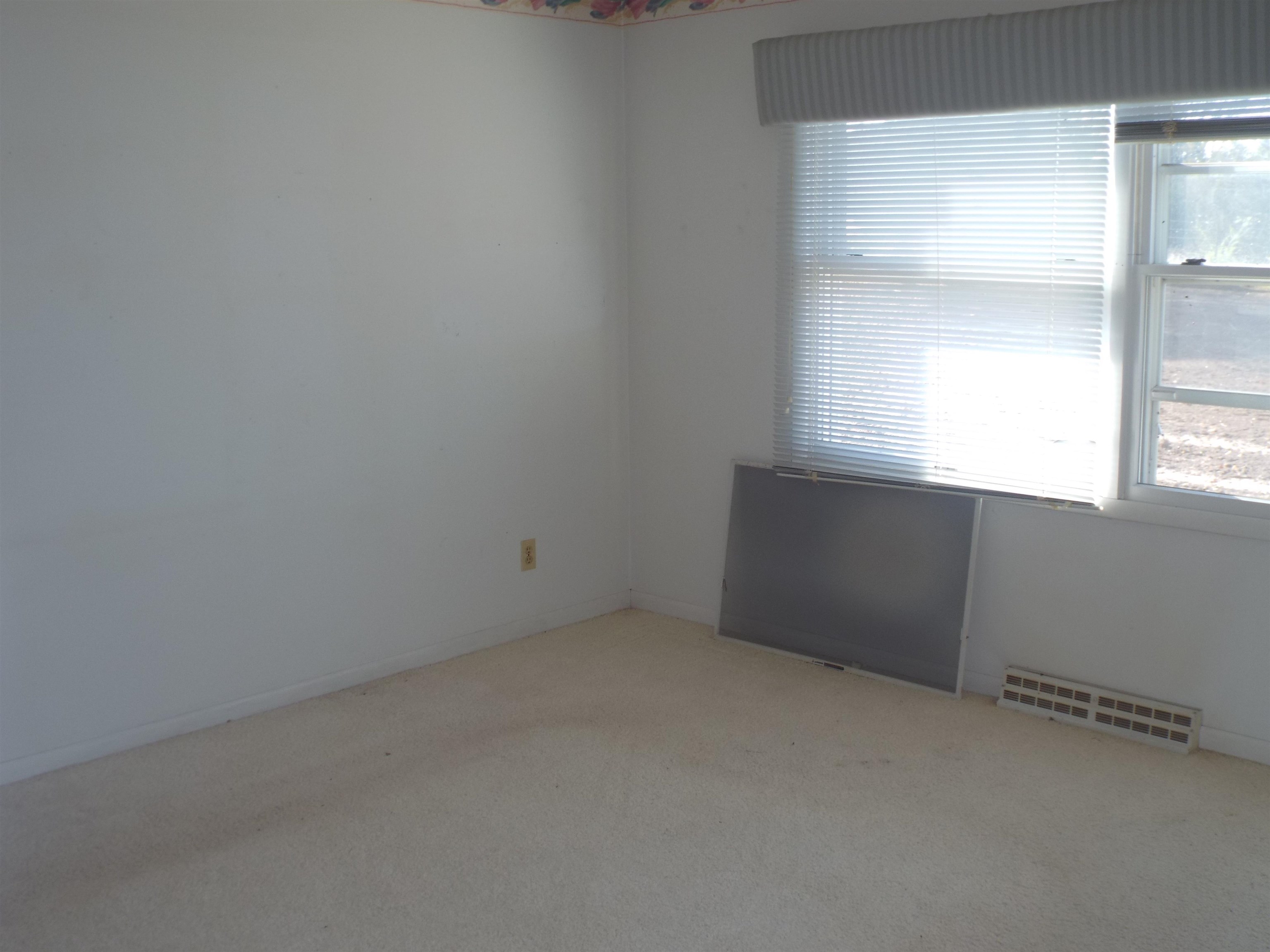 6090 South Rodden Road Hanover, IL 61041 - Photo 9 of 34 an empty room with a window