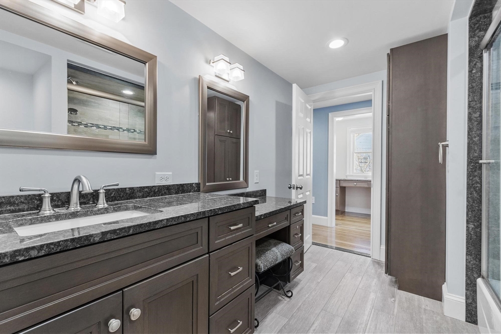 97 Hartwell Road Bedford, MA 01730 - Photo 10 of 42 a bathroom with a granite countertop double vanity sink and a mirror