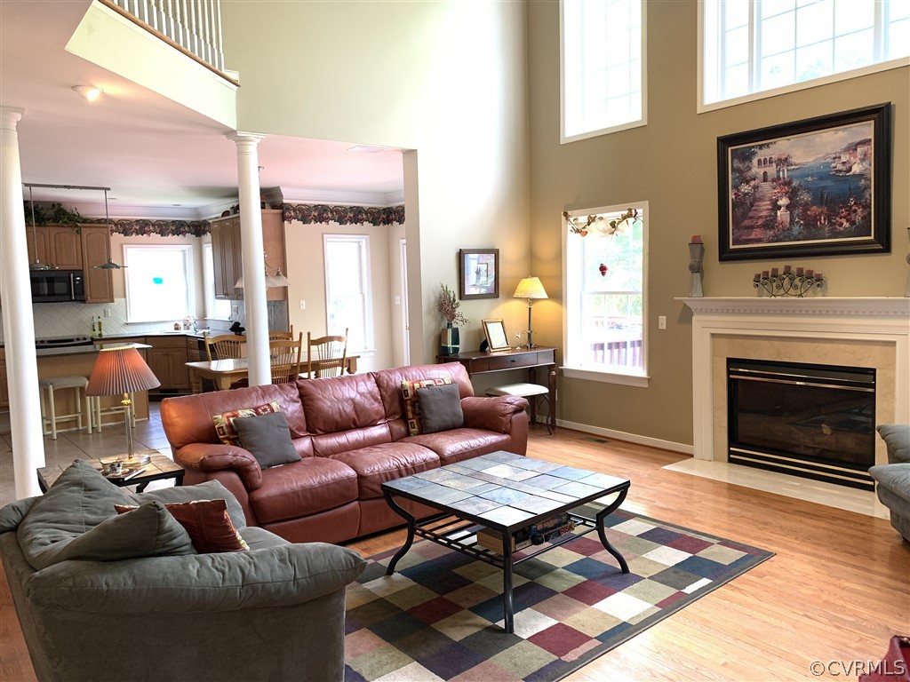 1400 Goswick Ridge Road Midlothian, VA 23114 - Photo 5 of 24 a living room with furniture a fireplace and a large window