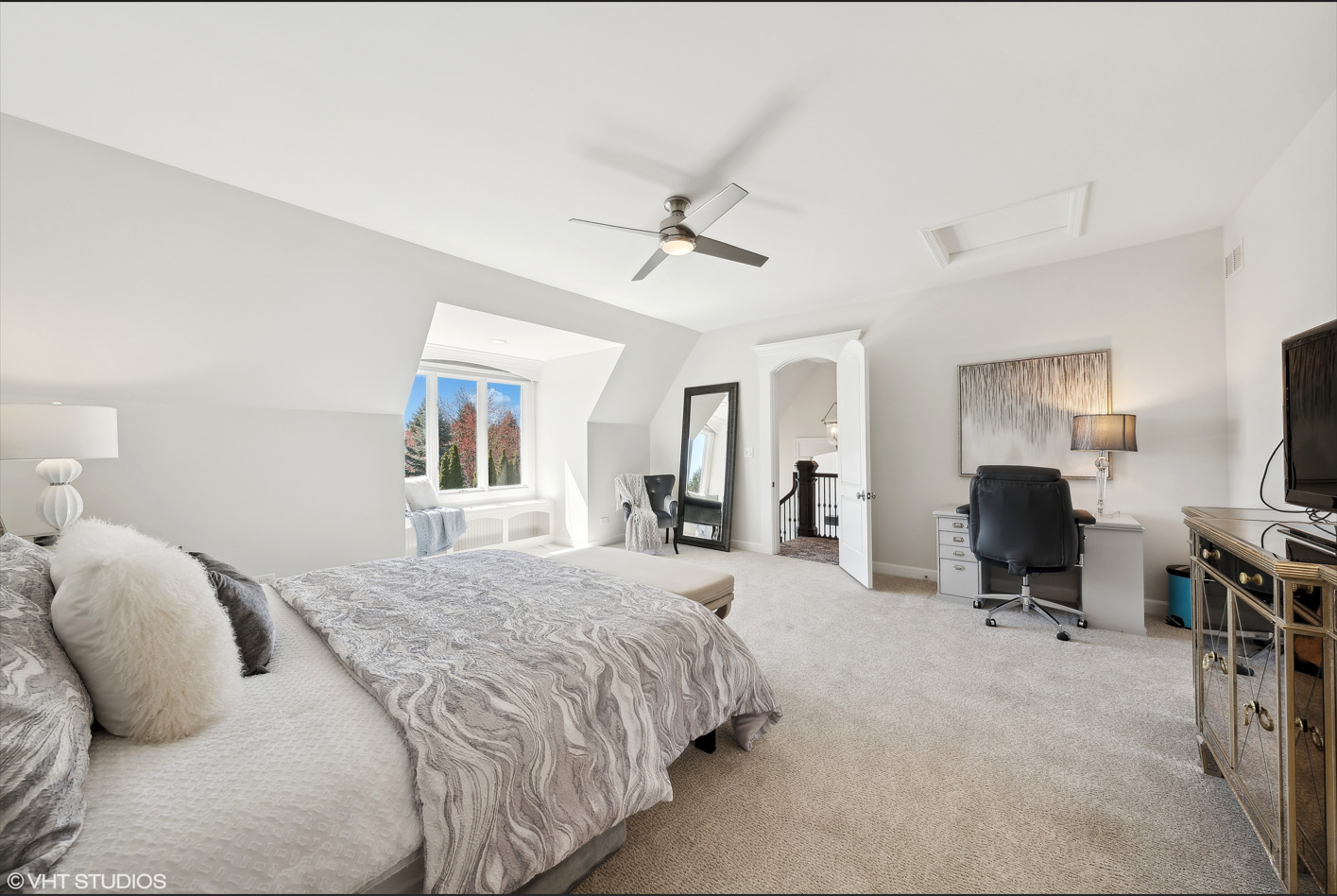 34-w033 White Thorne Road St. Charles, IL 60174 - Photo 69 of 100 a bedroom with a bed flat screen tv and couches