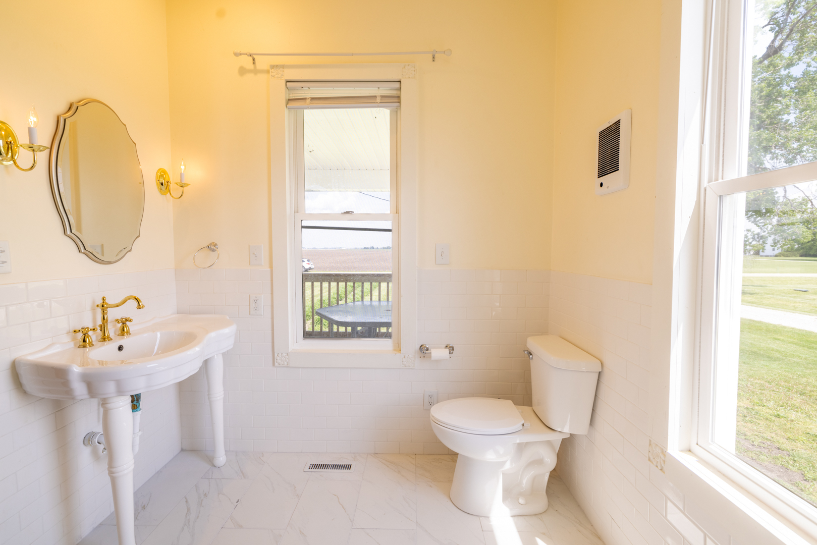 17846 West 3000S Road Buckingham, IL 60917 - Photo 23 of 30 a bathroom with a toilet sink and mirror