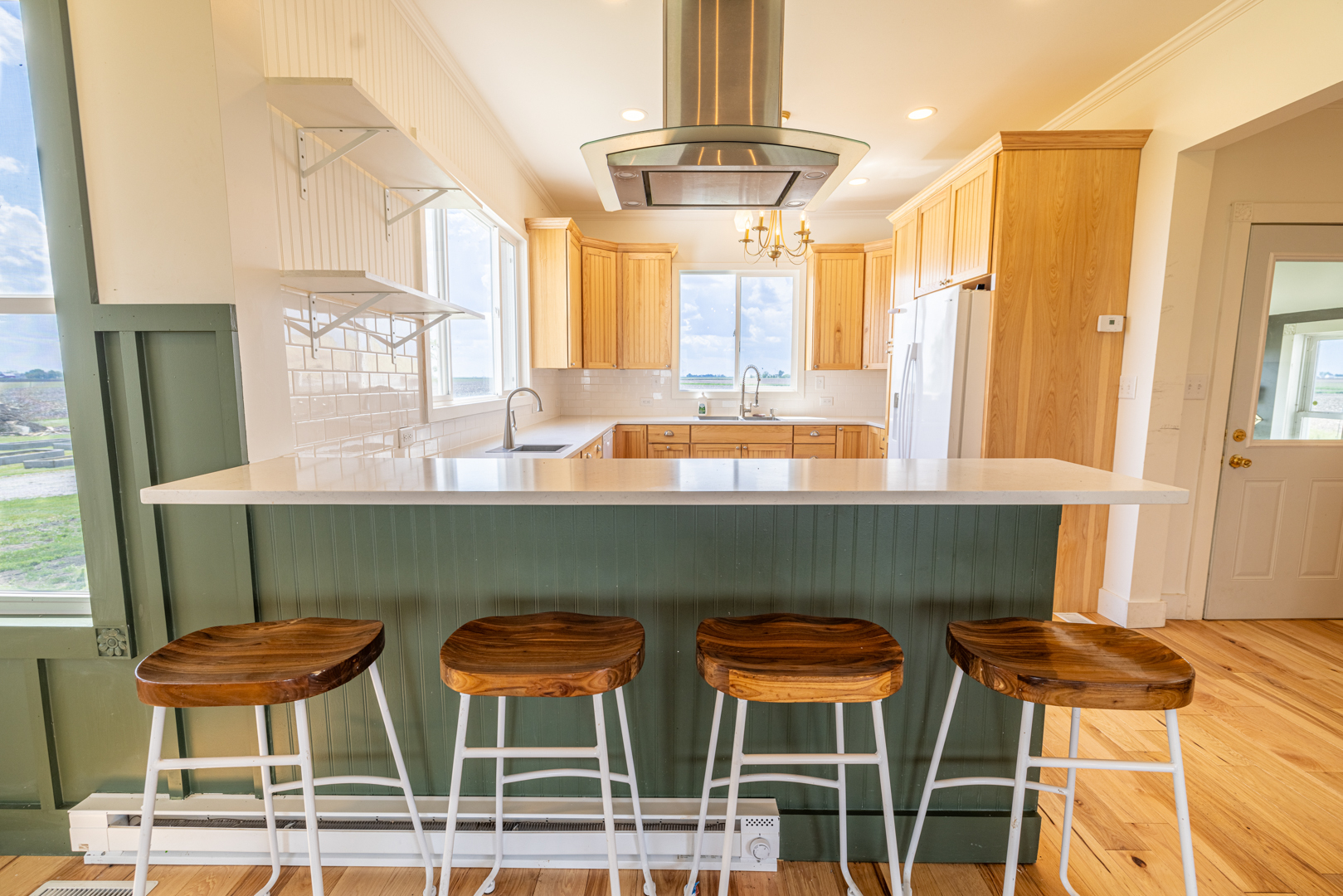 17846 West 3000S Road Buckingham, IL 60917 - Photo 5 of 30 a kitchen with a table chairs and a refrigerator