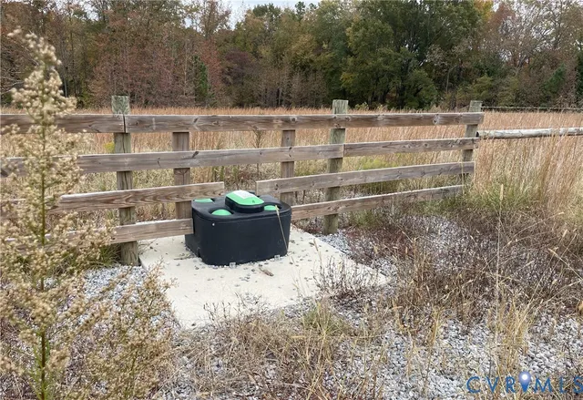 a view of a chairs and table on the side of the house