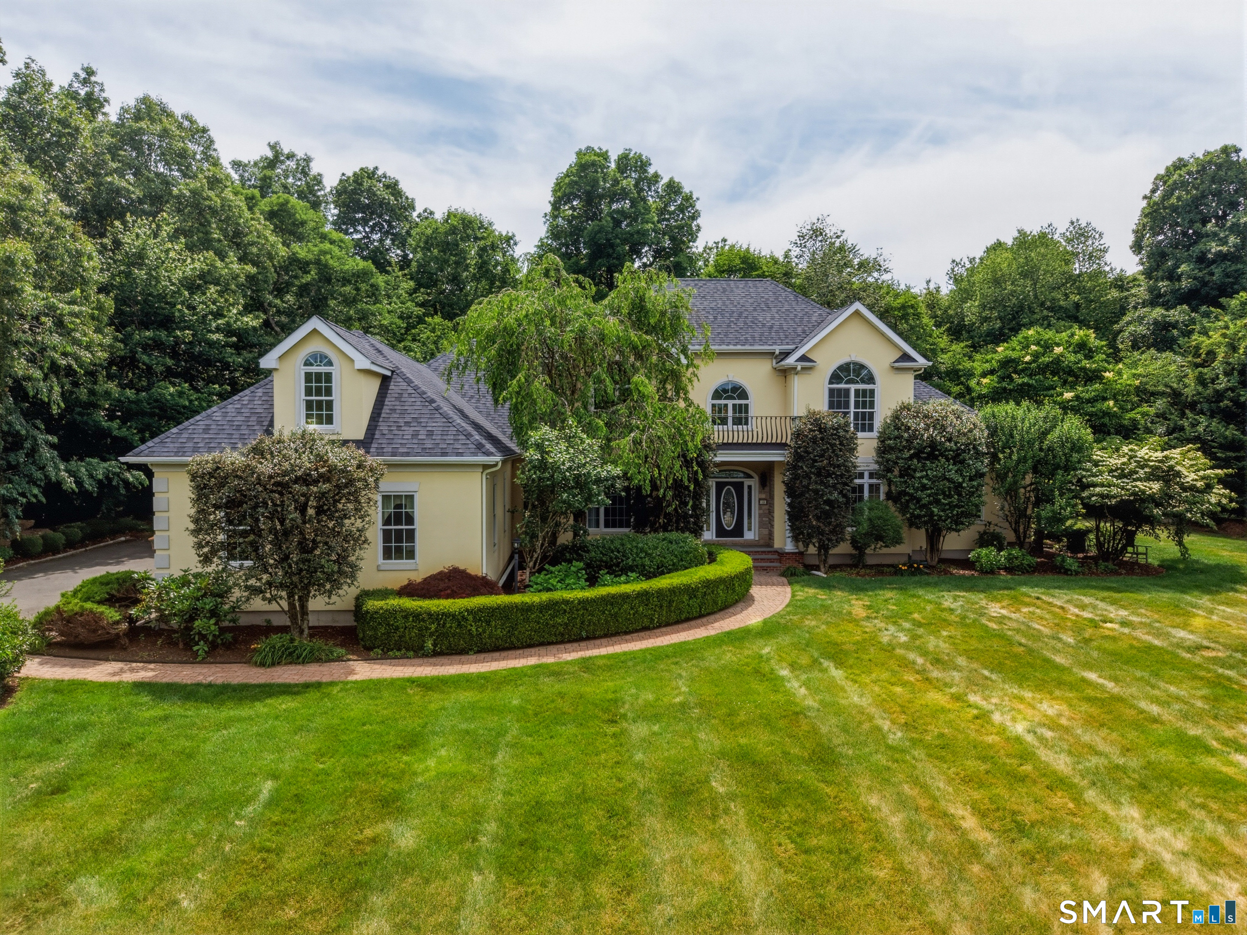 122 Lower Road Guilford, CT 06437 - Photo 2 of 40 WELCOME HOME... Nestled on a beautifully landscaped 1.84-acre lot, this property offers lovely curb appeal with a lush lawn, mature plantings and specimen trees that create a picturesque setting.