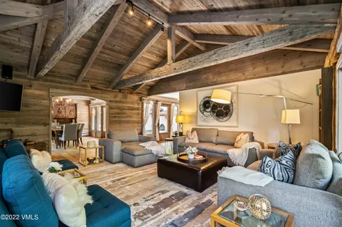 a living room with furniture fireplace and a flat screen tv