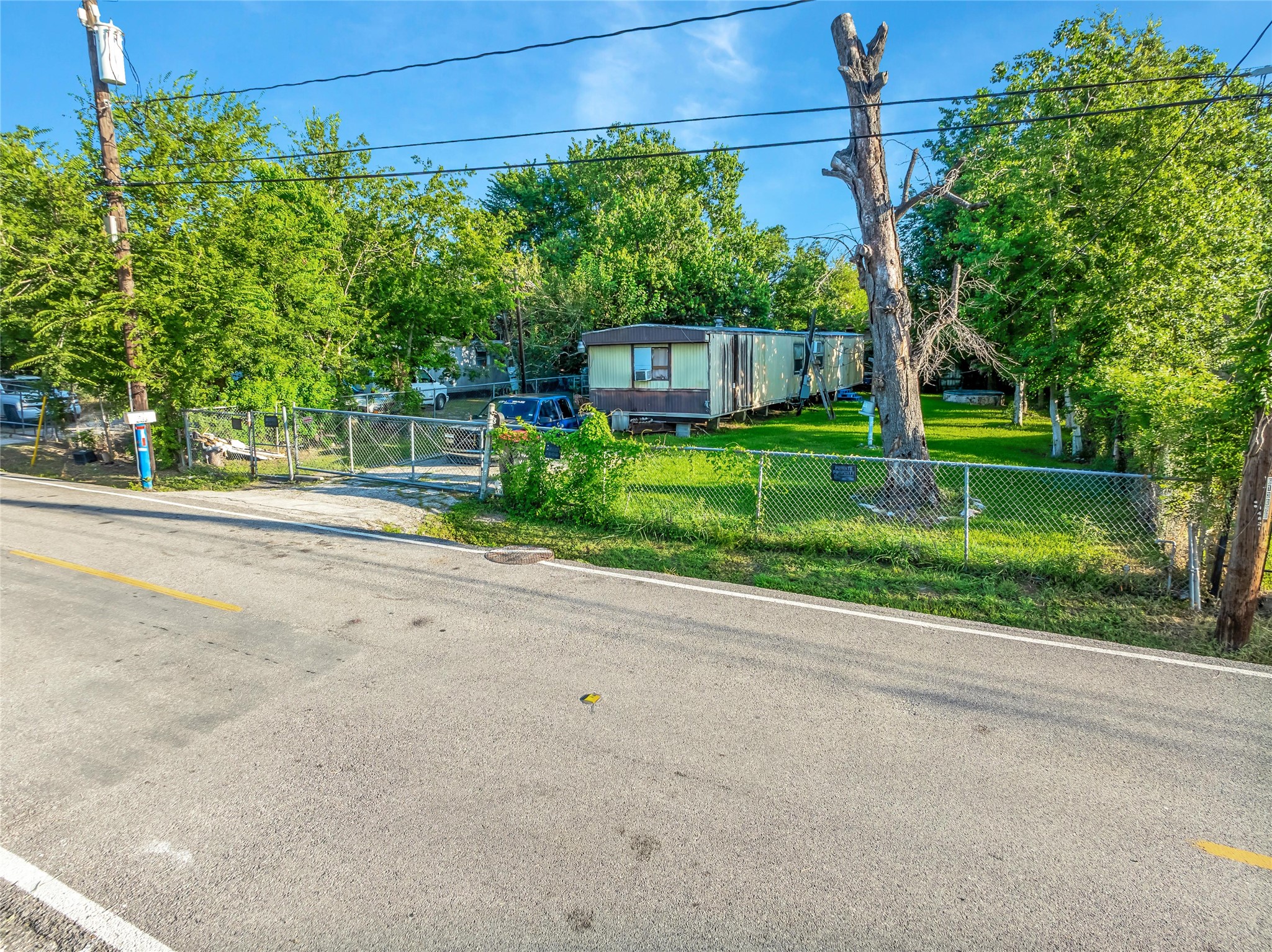 719 Manor Street Houston, TX 77015 - Photo 11 of 24 a front view of a house with a yard and potted plants