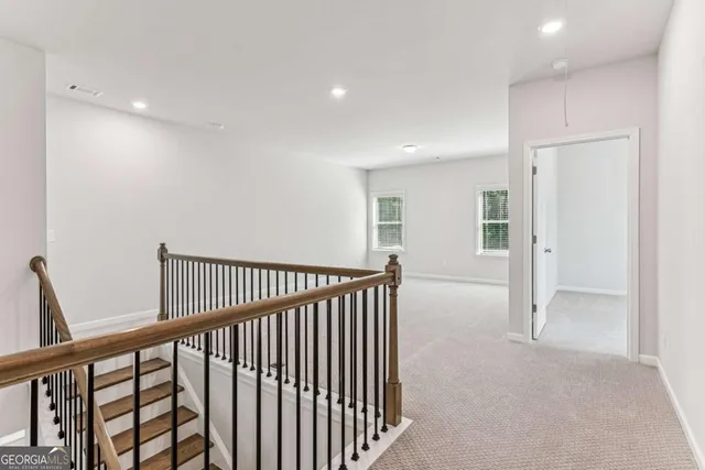 a view of a hallway with closet area