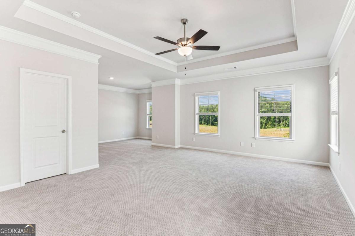 5537 Keswick Drive, Unit 8 Flowery Branch, GA 30542 - Photo 24 of 42 a view of an empty room with a window