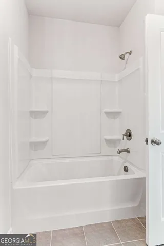 a bathroom with bathtub