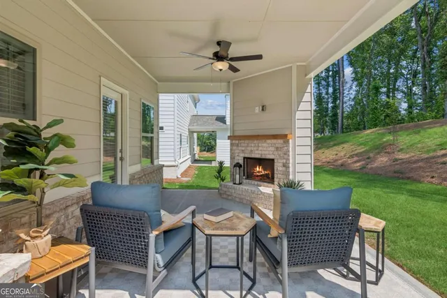 a outdoor space with a couch and a fireplace
