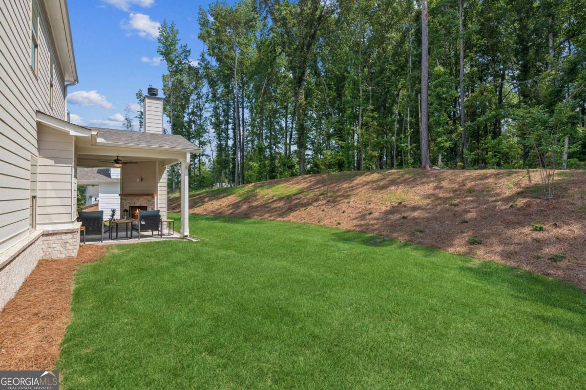 5537 Keswick Drive, Unit 8 Flowery Branch, GA 30542 - Photo 38 of 42 a view of a outdoor space and a yard