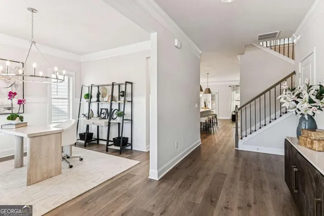 a view of a kitchen with furniture and staircase