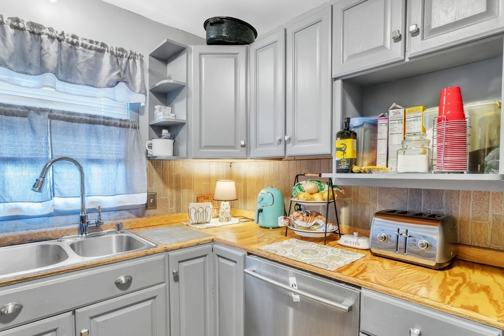 89 Pine Grove Street Springfield, MA 01119 - Photo 14 of 26 a kitchen with a sink and a cabinets