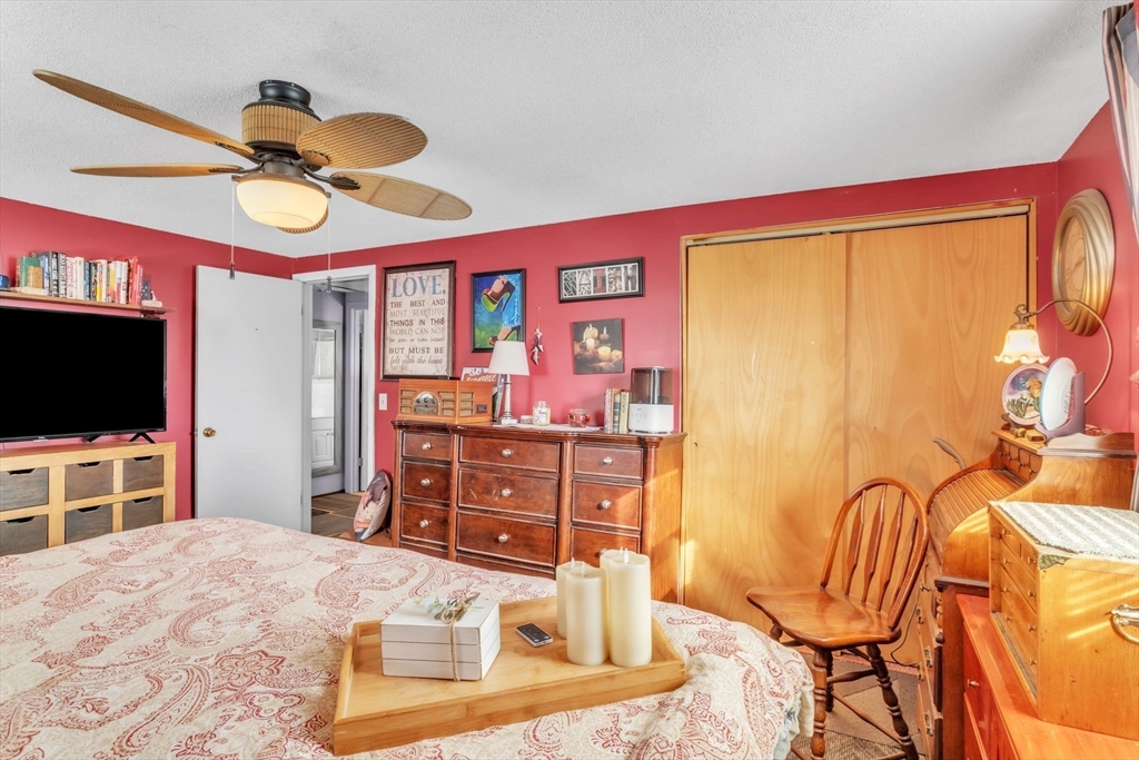 89 Pine Grove Street Springfield, MA 01119 - Photo 21 of 26 a bedroom with a bed and a flat screen tv