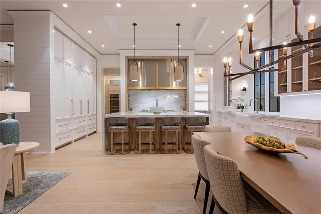 a kitchen with lots of counter space and furniture