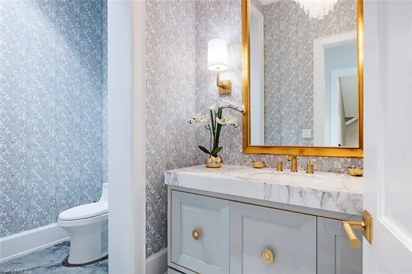 a bathroom with a sink and a toilet