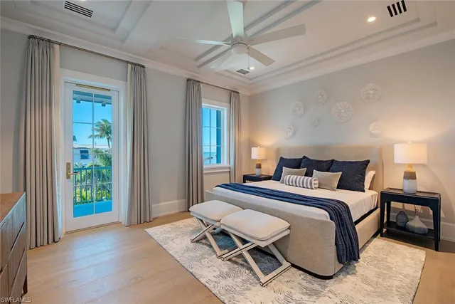 a spacious bedroom with a bed and a window