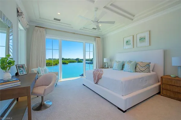 a bedroom with a bed and a couch