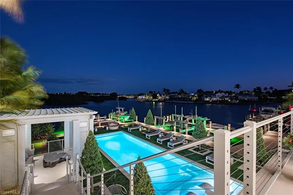 a view of a chairs and table in patio