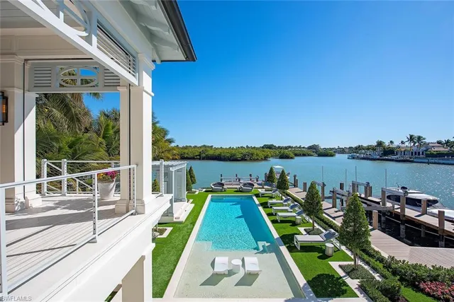 a view of a balcony with couch and wooden floor