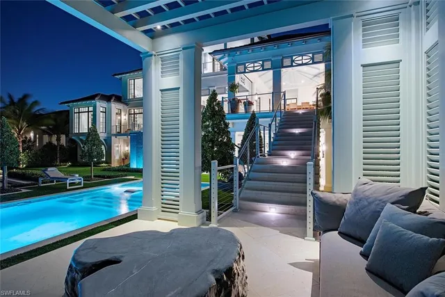 a view of living room and deck with furniture
