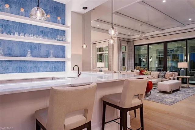 a kitchen with a sink and a refrigerator