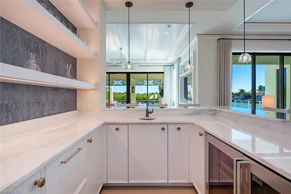 a kitchen with a sink and a refrigerator