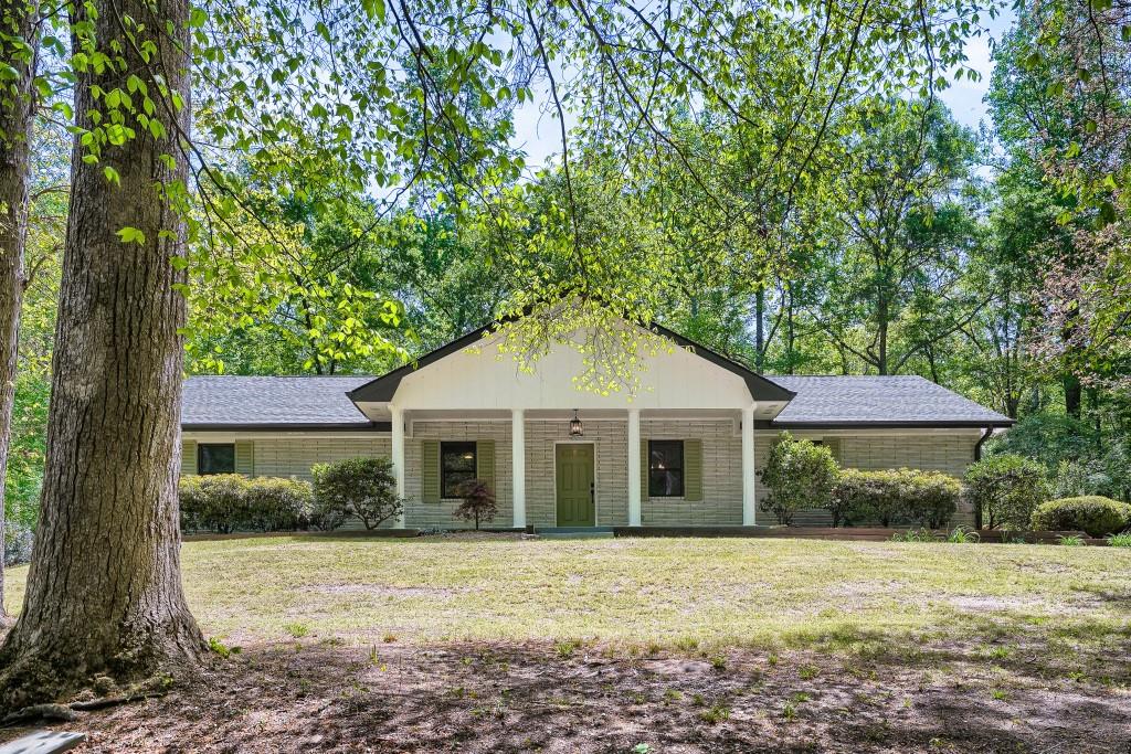 2021 Irwin Bridge Road Northwest Conyers, GA 30012 - Photo 1 of 43 a view of a yard in front of a house with large tree