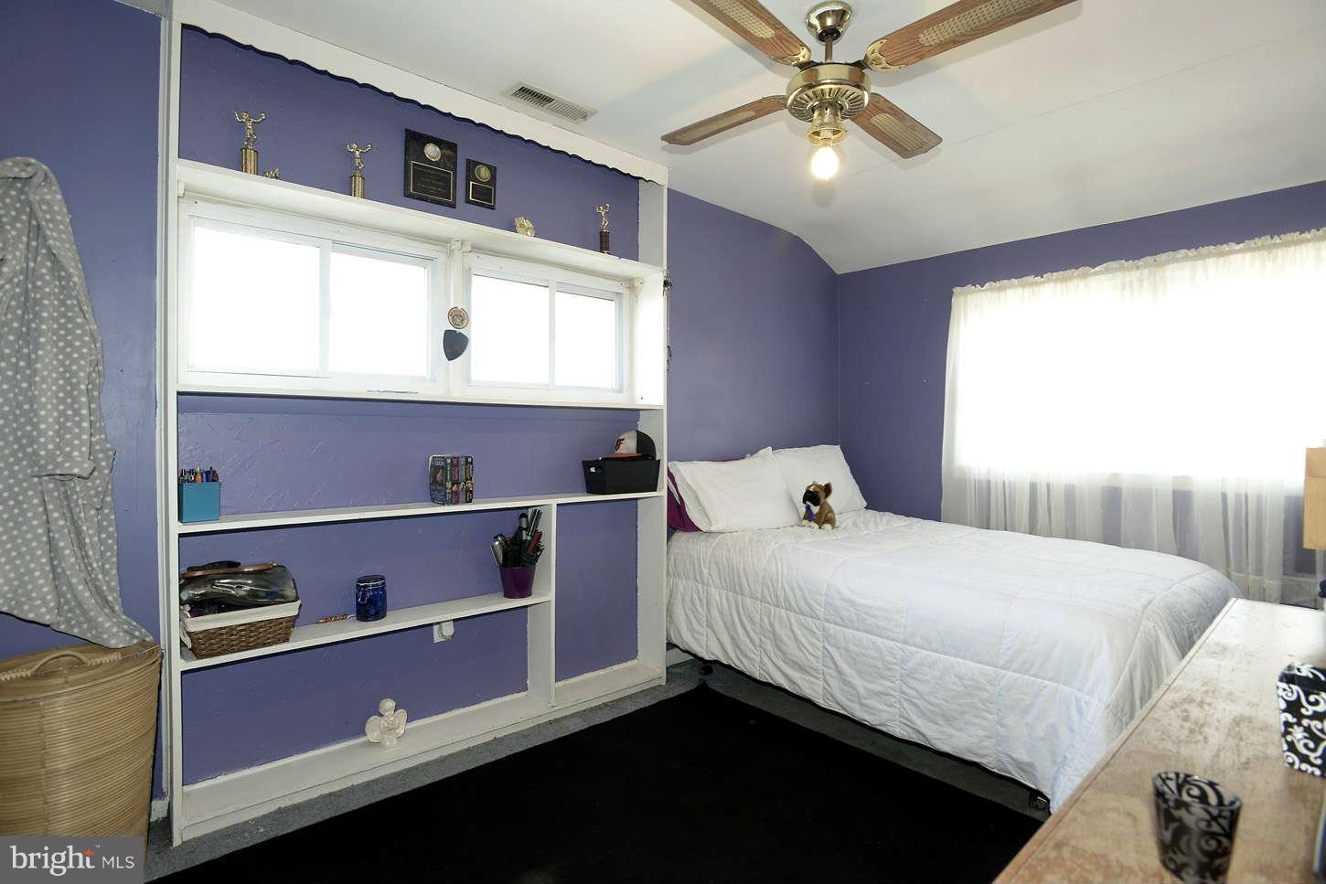8536 Kings Ridge Road Baltimore, MD 21234 - Photo 14 of 19 a bedroom with a bed and window