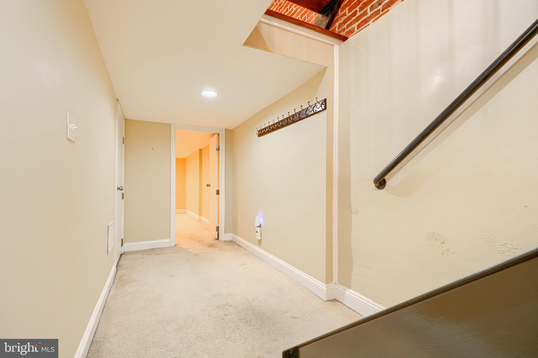 232 South Ann Street Baltimore, MD 21231 - Photo 49 of 62 Inviting hallway with warm tones.