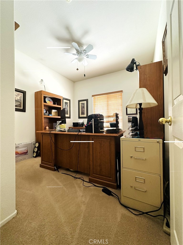 1665 Ravenswood Road Beaumont, CA 92223 - Photo 19 of 41 a living room with furniture and flat screen tv