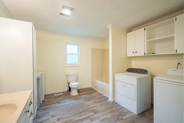 a bathroom with a sink a toilet and a bathtub