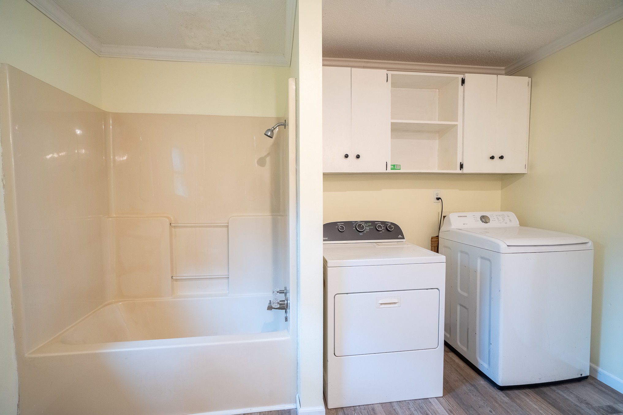 715 Springer Road Hohenwald, TN 38462 - Photo 14 of 30 a view of bathroom with a washer and dryer