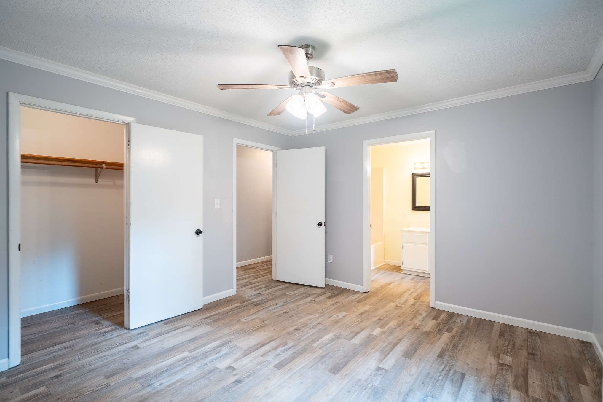 715 Springer Road Hohenwald, TN 38462 - Photo 16 of 30 wooden floor in an empty room with a window
