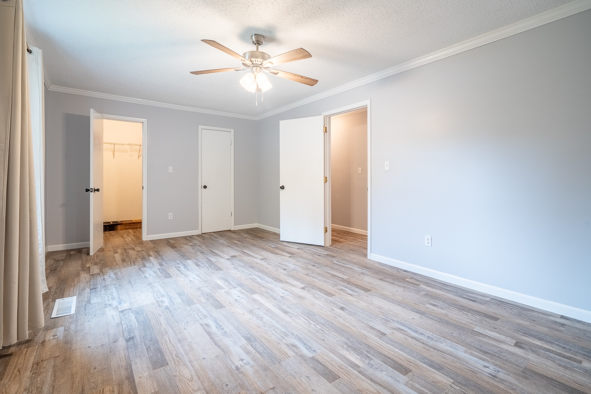 715 Springer Road Hohenwald, TN 38462 - Photo 18 of 30 wooden floor in an empty room with a window