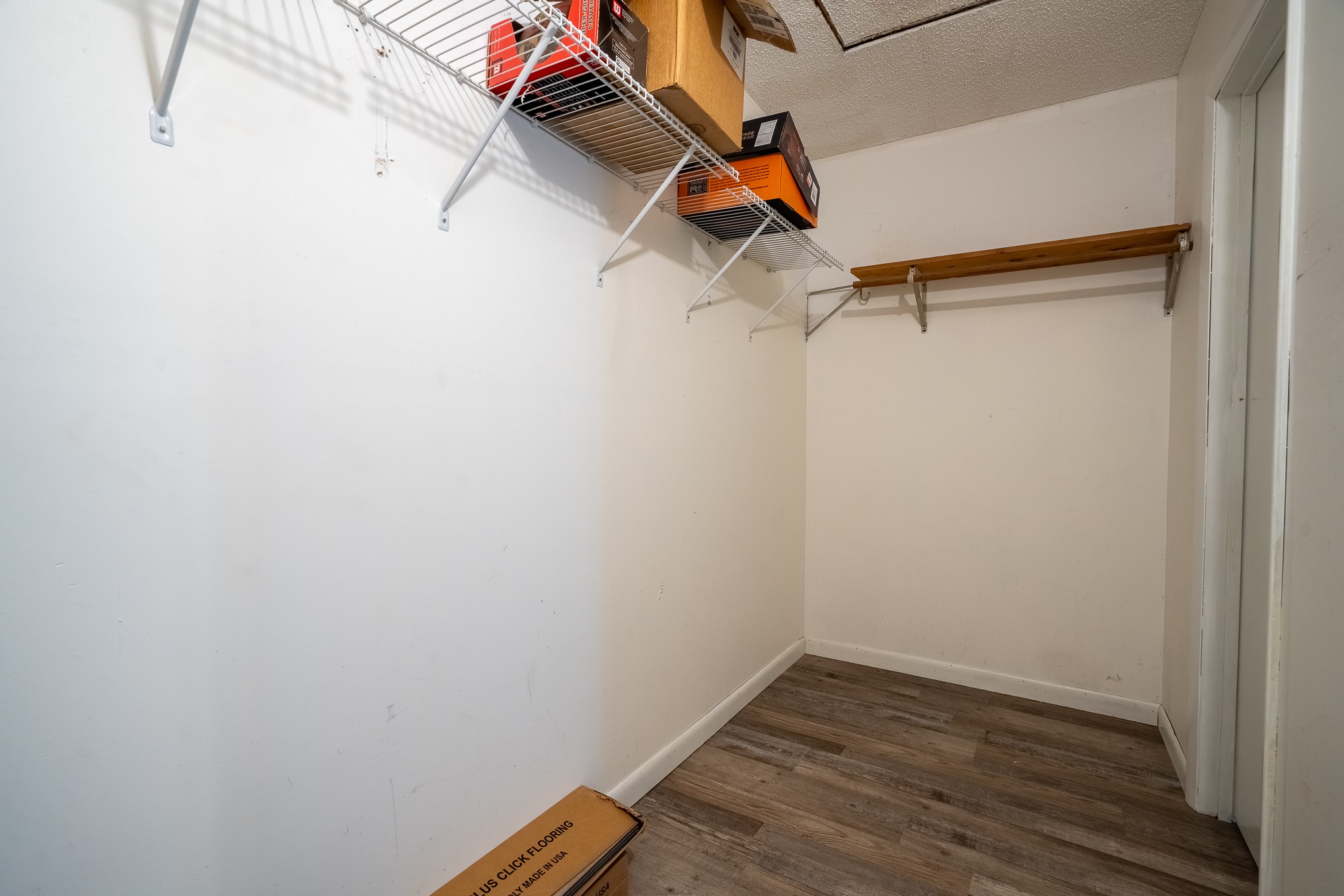 715 Springer Road Hohenwald, TN 38462 - Photo 20 of 30 a view of a room with wooden floor and fan