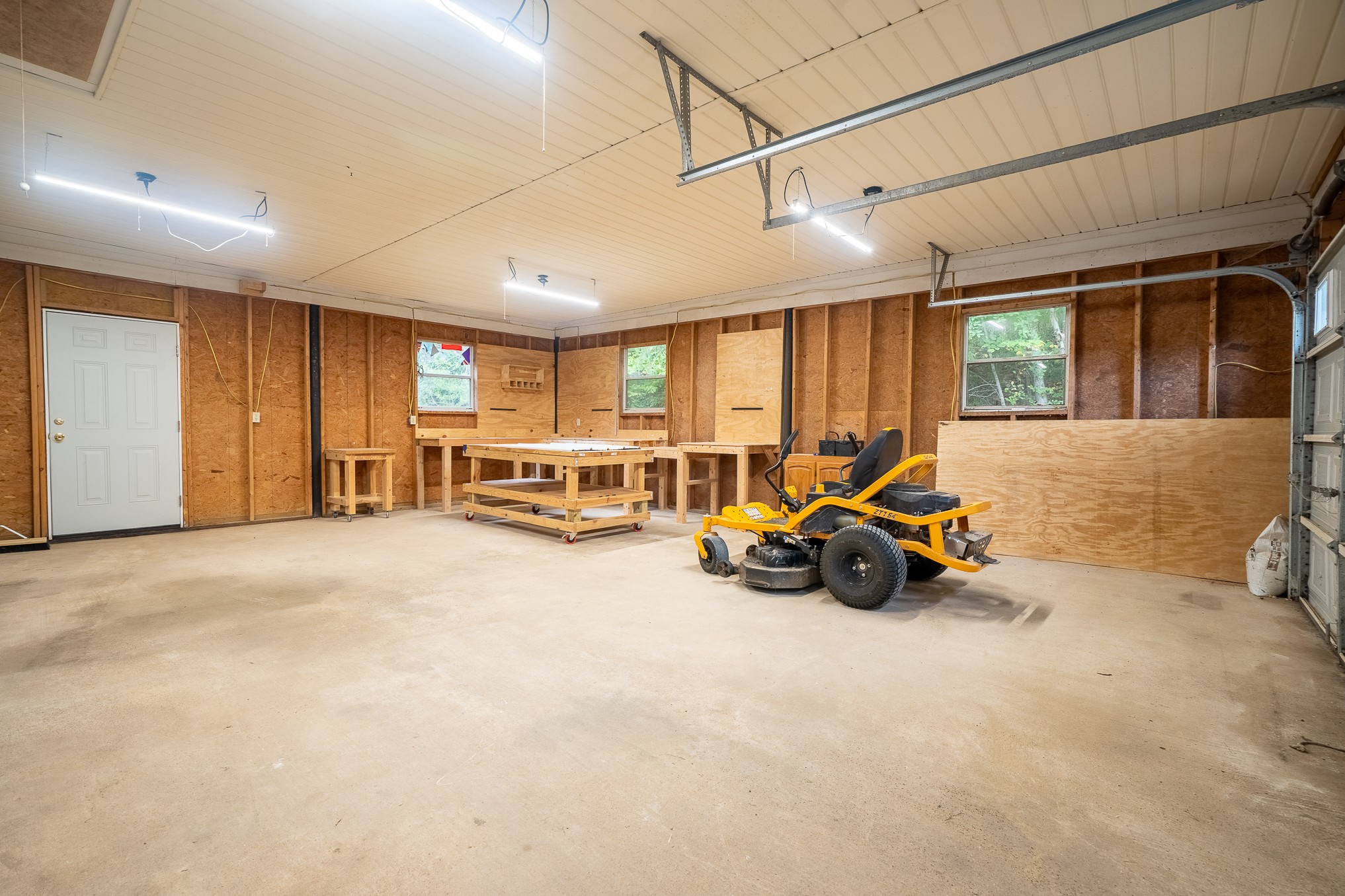 715 Springer Road Hohenwald, TN 38462 - Photo 21 of 30 a view of a livingroom with furniture and cars parked