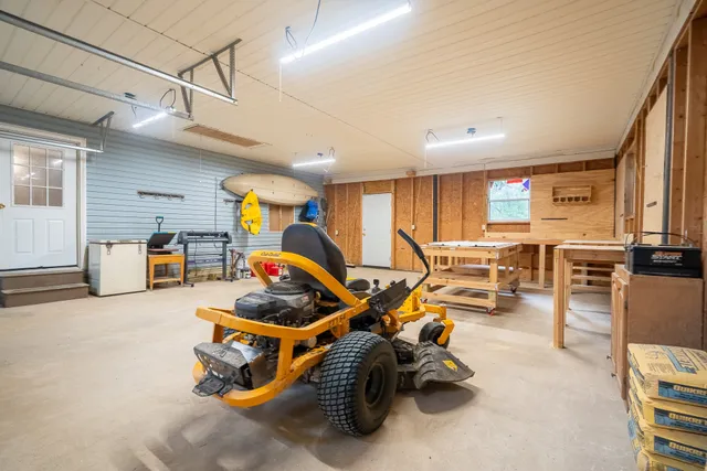 a room with gym equipment and windows